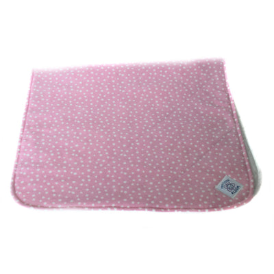 A diaper change pad made of organic cotton flannel in a Confetti Pink pattern, quilted to a layer of organic cotton batting, and backed with a layer of waterproof fabric, part of the So Soft Organic Baby Accessories Gift Package.